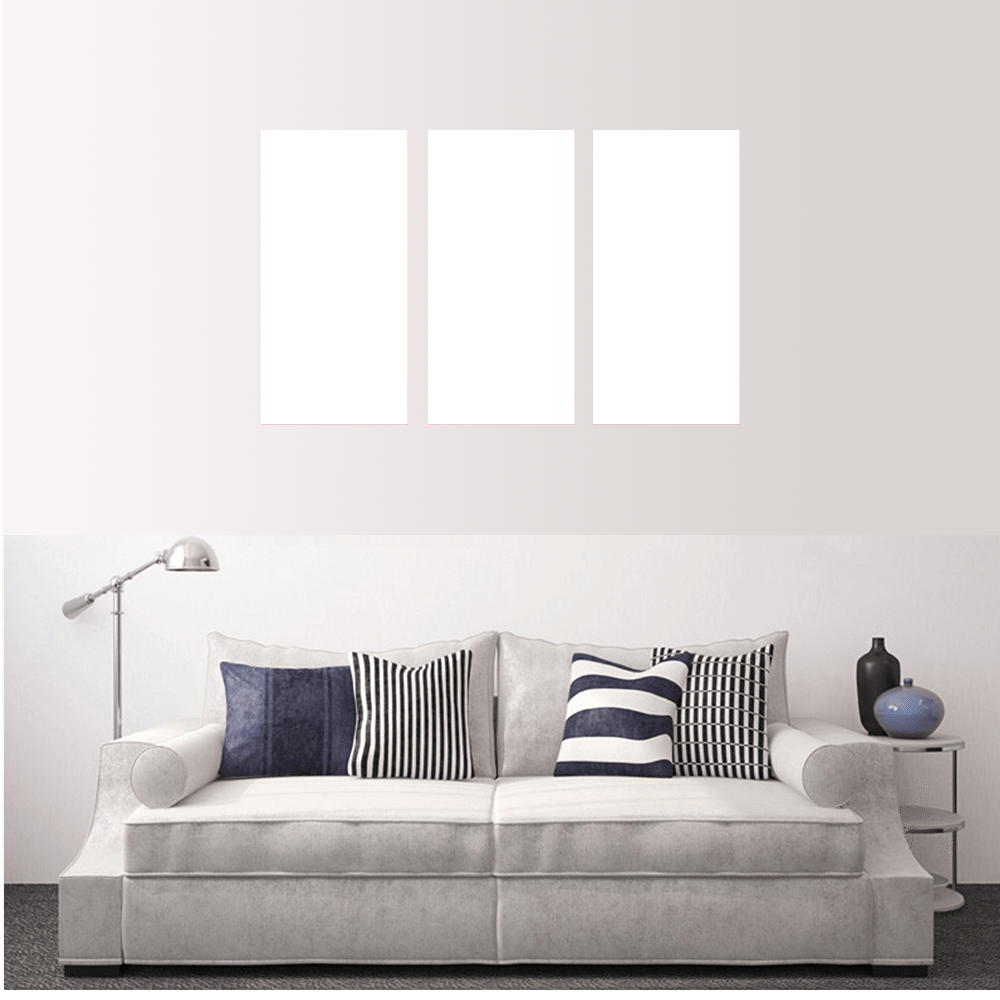 Custom split canvas prints arranged above a stylish sofa in a modern living room setting.