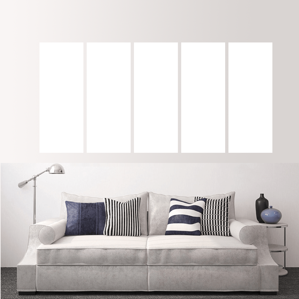 Custom split canvas prints displayed above a modern couch in a stylish living room setting.