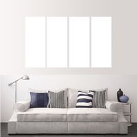 Custom split canvas prints displayed above a stylish sofa in a modern living room setting.