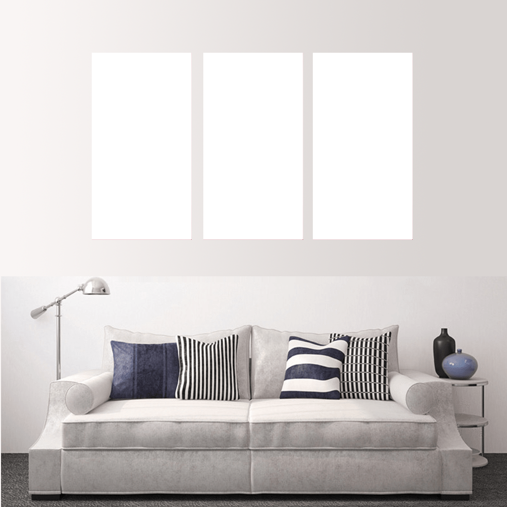 Custom split canvas prints displayed above a stylish sofa in a modern living room setting.