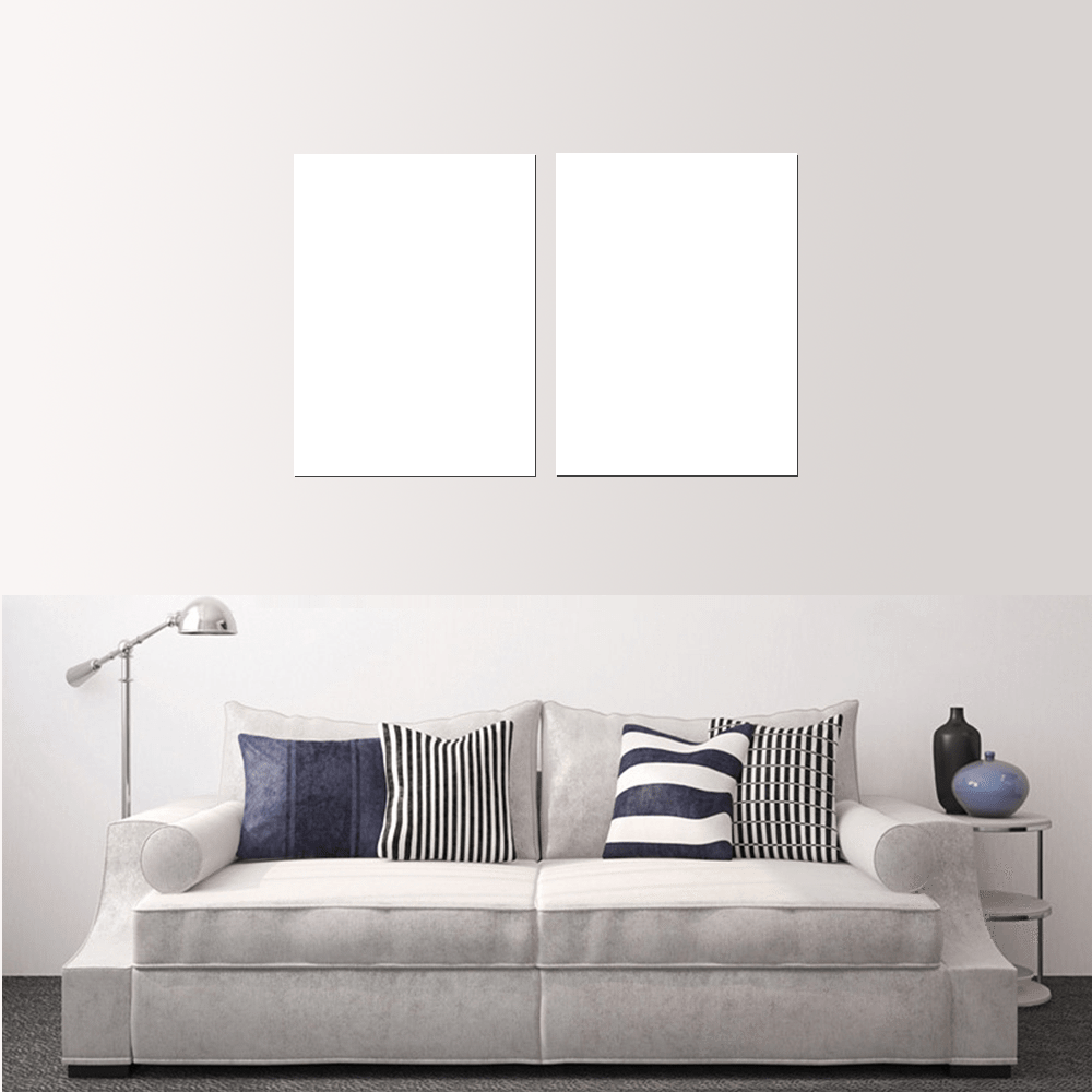 Custom split canvas prints displayed above a modern sofa with decorative pillows.