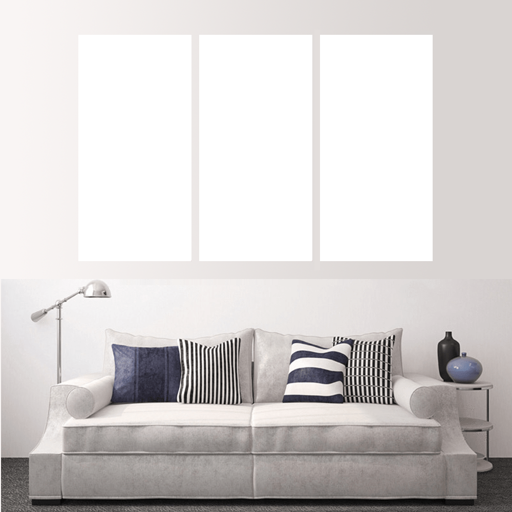 Custom split canvas prints showcased above a stylish gray sofa with decorative pillows.