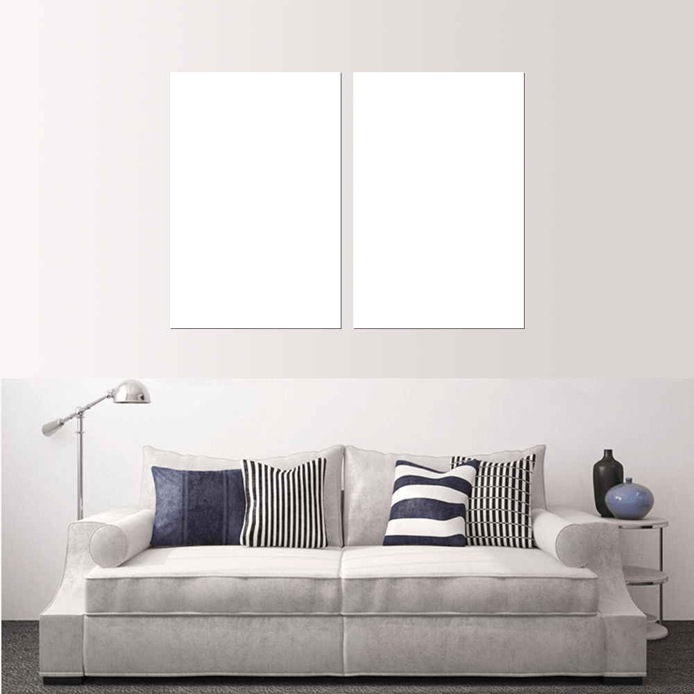 Stylish living room featuring a grey sofa with striped pillows and two empty frames for custom split canvas prints.