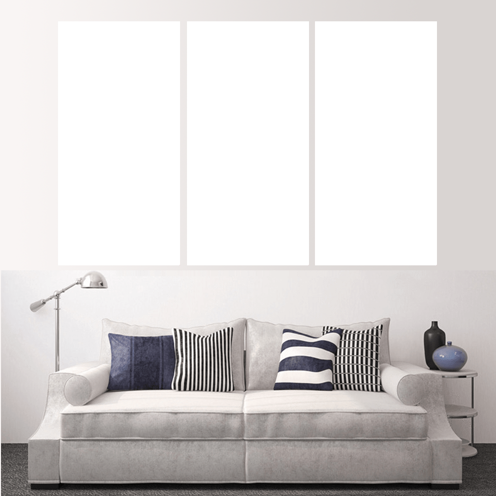 Custom split canvas prints displayed above a stylish couch with decorative pillows, creating a unique wall art experience.