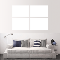 Custom split canvas prints arranged in four panels above a modern couch with decorative pillows.