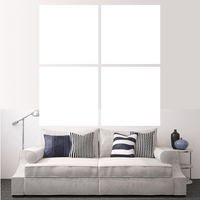 Custom split canvas prints displayed in a modern living room setting with a stylish gray sofa.