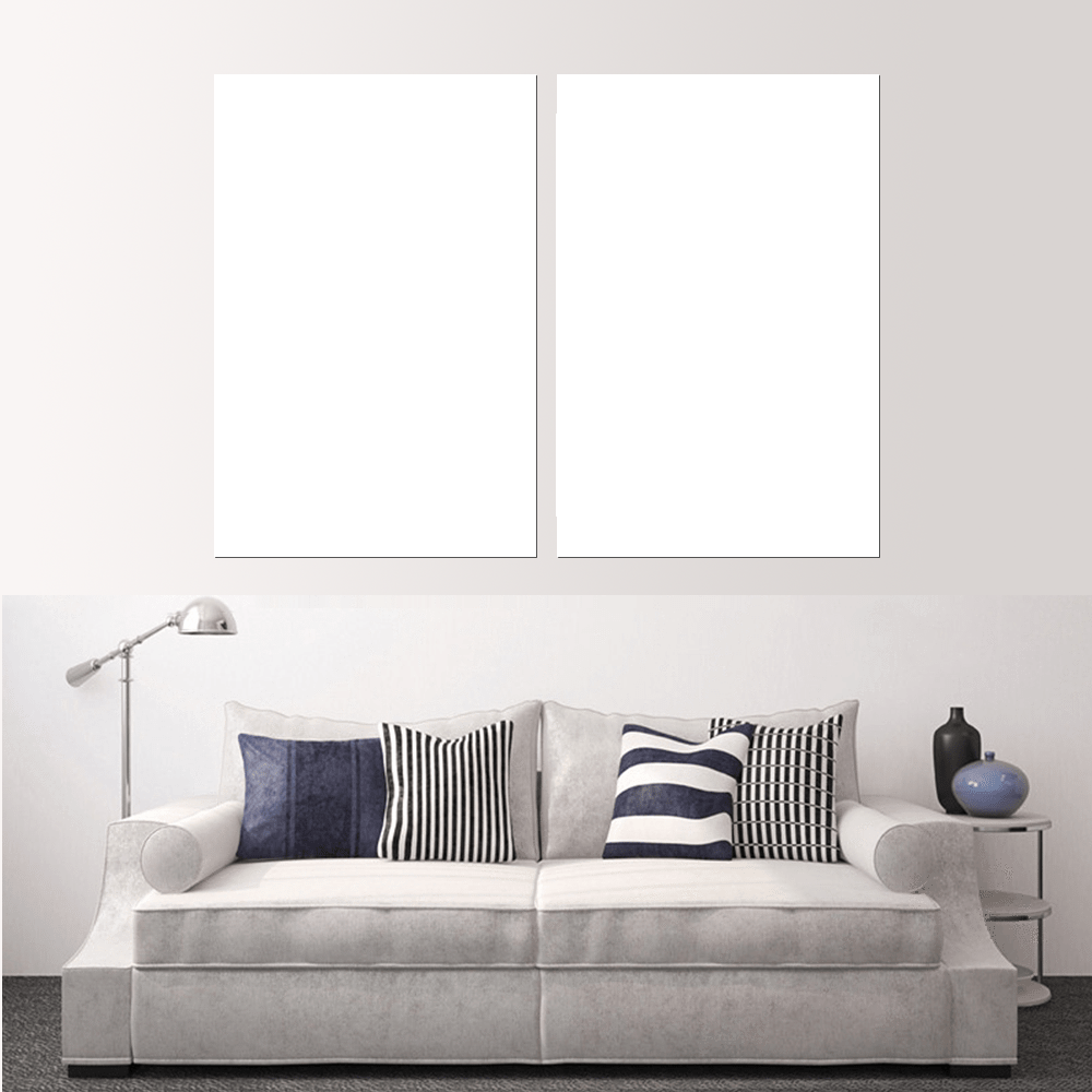 Custom split canvas prints displayed above a stylish gray sofa with decorative pillows.