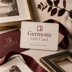 Germotte gift card lifestyle image with burgundy ribbon, framed artwork, and premium photo framing details.