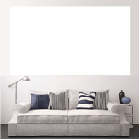 Stylish living room featuring custom split canvas prints above a modern sofa with decorative pillows.