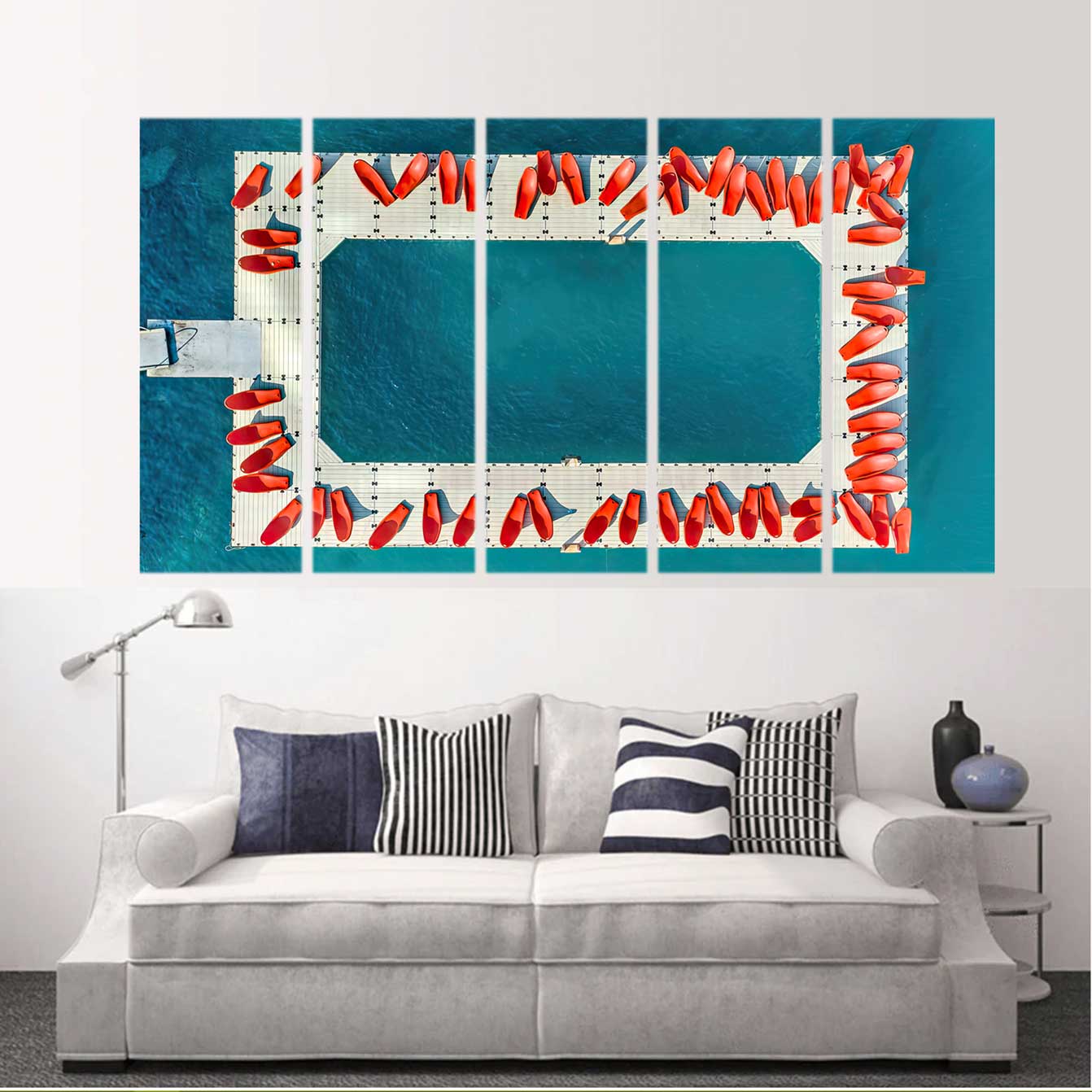 Custom split canvas prints featuring a dock with red buoys and turquoise water above a stylish couch.