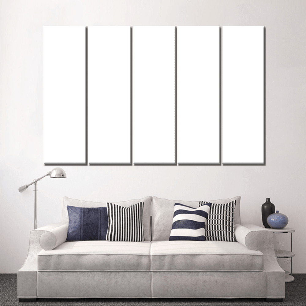 Custom split canvas prints displayed on a wall above a stylish sofa in a modern living room.
